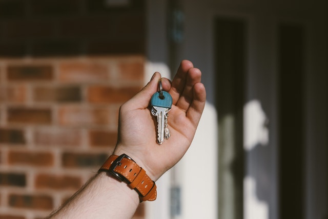 A New Atlanta Homeowner with His New House Key in His Hand