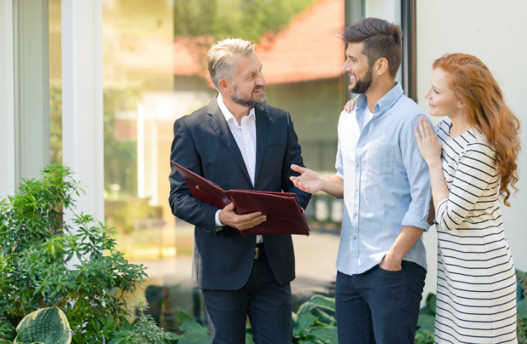 Homebuyers Talking to Their Real Estate Agent